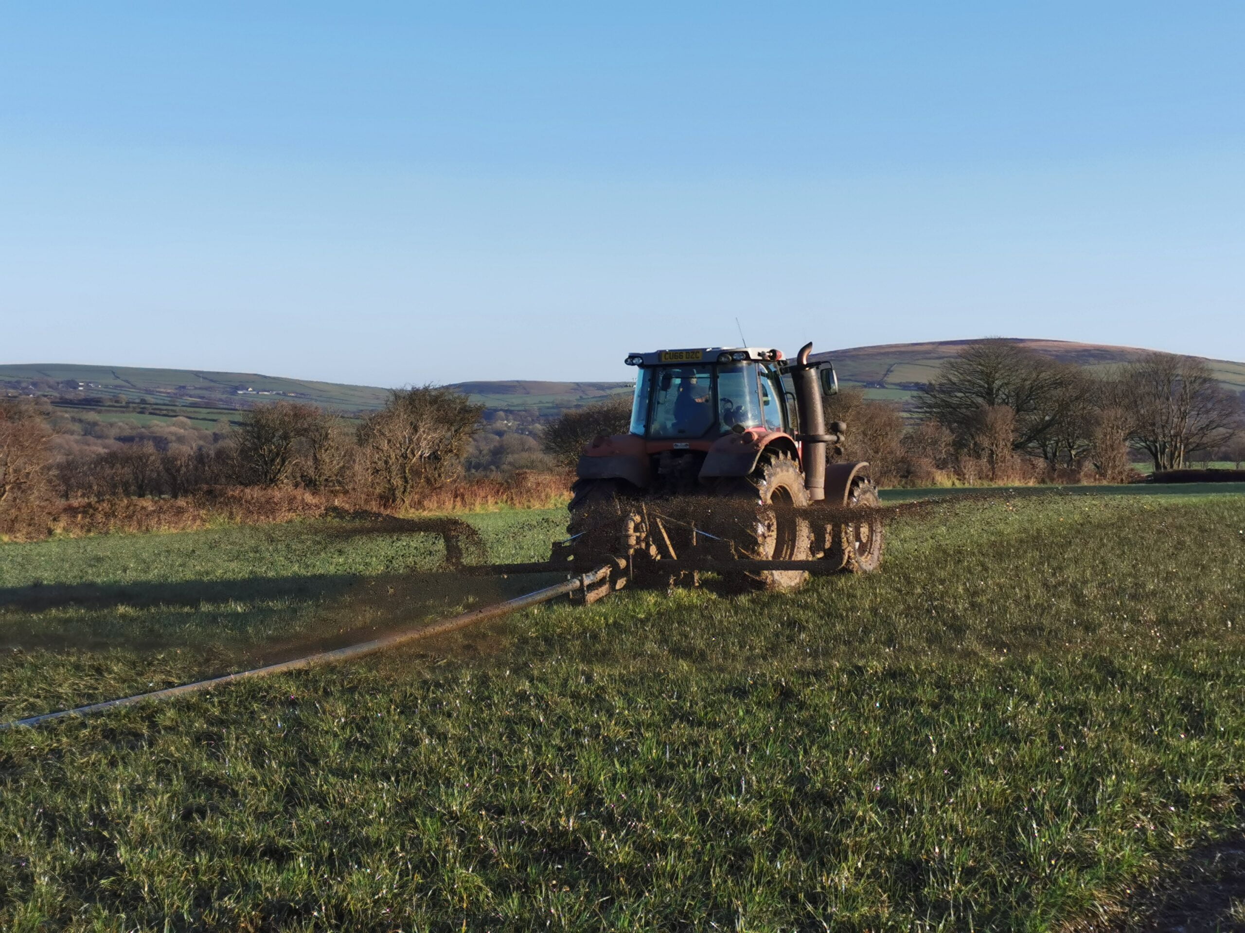 tractor in a field, get consistent slurry with our aeration system